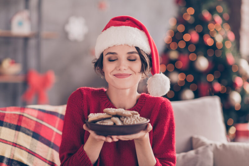 2025_12_woman enjoying christmas cookies